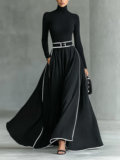 Elisa | Vestido maxi negro con costuras blancas y cuello alto