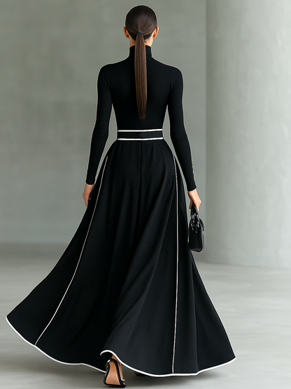 Elisa | Vestido maxi negro con costuras blancas y cuello alto